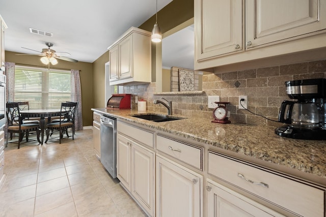kitchen featuring visible vents, decorative backsplash, ceiling fan, a sink, and dishwasher