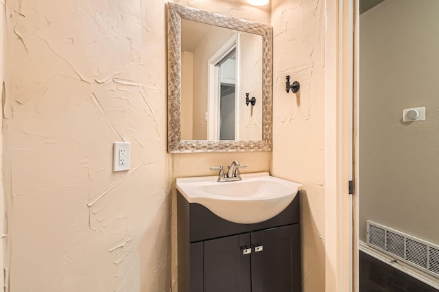 bathroom featuring visible vents and vanity