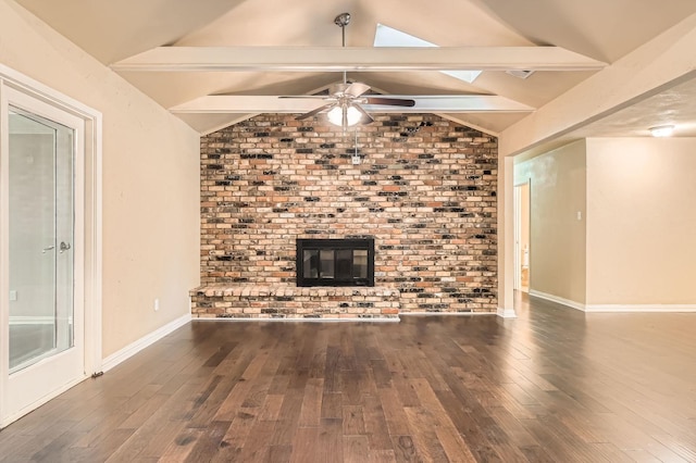 unfurnished living room featuring baseboards, a ceiling fan, vaulted ceiling with skylight, and hardwood / wood-style floors