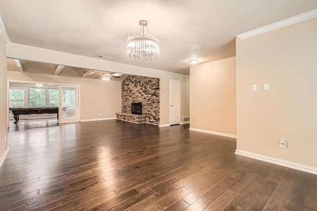 unfurnished living room featuring visible vents, baseboards, ceiling fan with notable chandelier, and dark wood-style floors