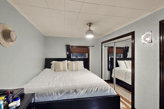 2241 Riviera Dr, Dallas, TX 75211 - bedroom with crown molding and wood finished floors