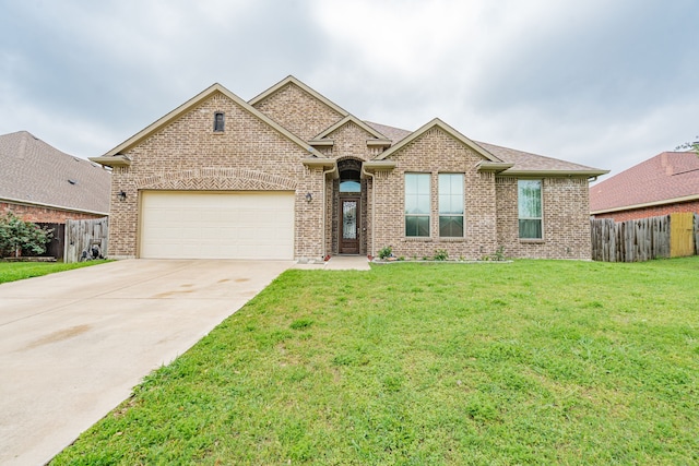ranch-style home with brick siding, a garage, fence, and driveway