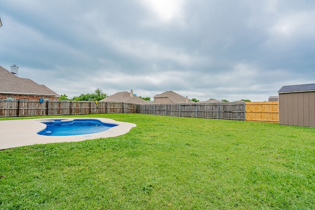 view of swimming pool featuring a lawn, a patio, a fenced in pool, and a fenced backyard