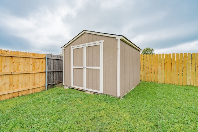 view of shed with a fenced backyard