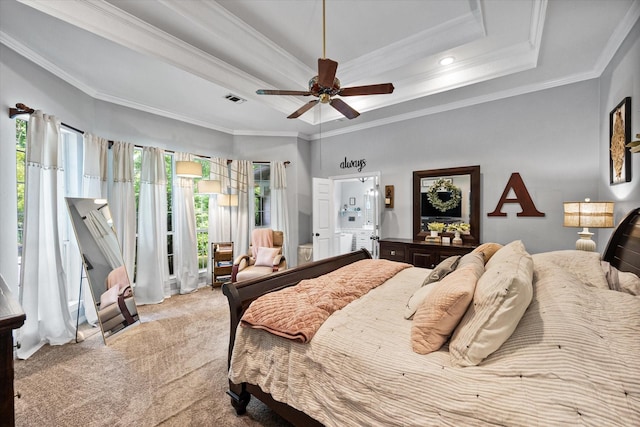 bedroom featuring crown molding, a raised ceiling, light carpet, and visible vents