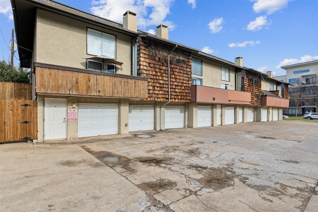 exterior space featuring a chimney and stucco siding
