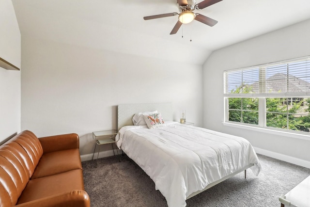 carpeted bedroom featuring a ceiling fan, baseboards, and lofted ceiling