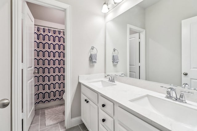 bathroom featuring a sink, tile patterned floors, double vanity, and a shower with shower curtain