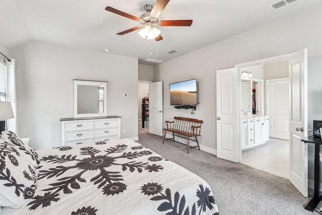 bedroom with baseboards, visible vents, vaulted ceiling, and light colored carpet