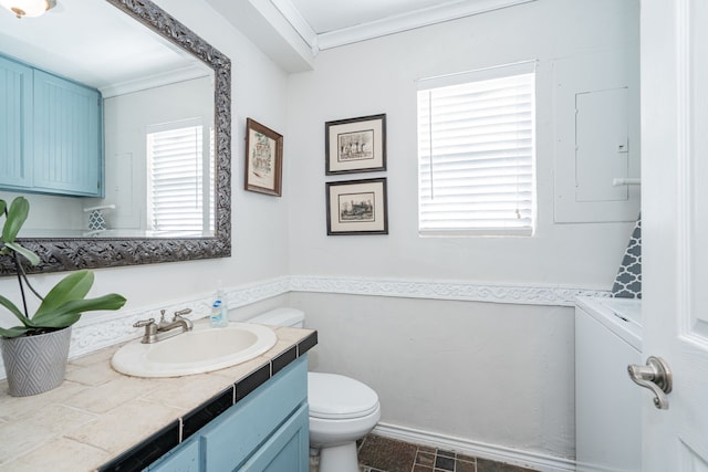 bathroom featuring crown molding, toilet, washer / dryer, and vanity