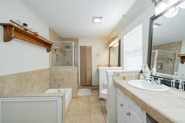 full bath featuring vanity, visible vents, toilet, a bath, and a stall shower