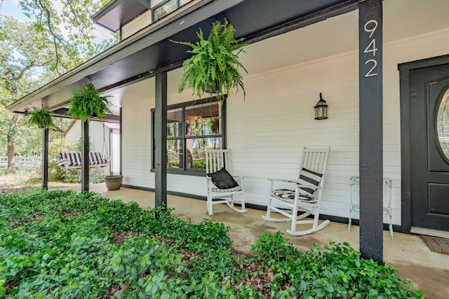 doorway to property featuring a porch