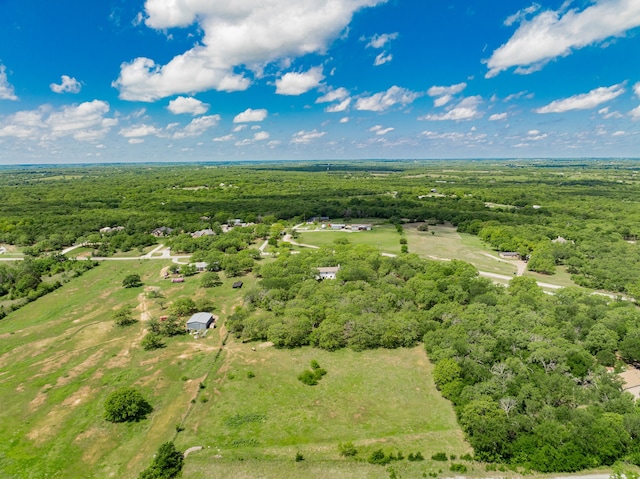 birds eye view of property with a wooded view