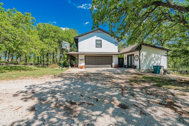 view of front of house featuring an attached garage and driveway
