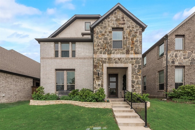 view of front of property with brick siding, stone siding, and a front lawn