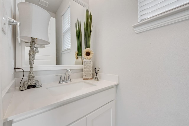bathroom featuring vanity and visible vents