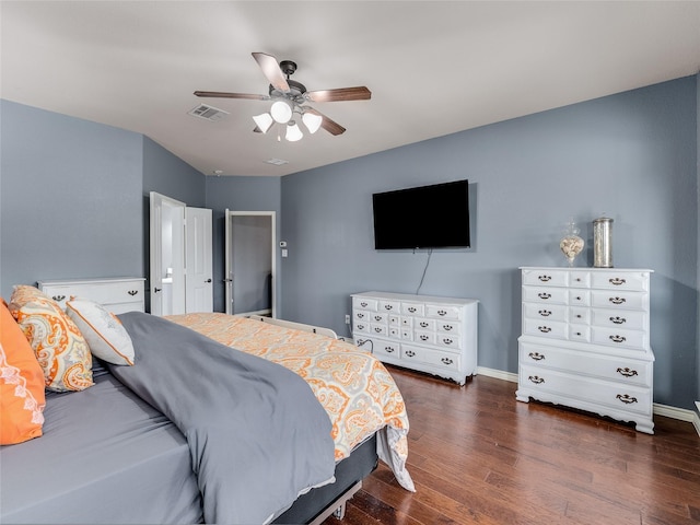 5732 Chateau Dr, Sachse, TX 75048 - bedroom featuring dark wood-style flooring, a ceiling fan, and baseboards