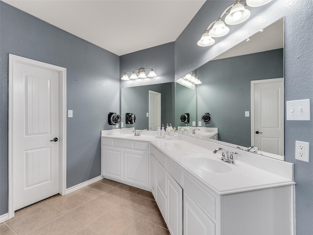 5732 Chateau Dr, Sachse, TX 75048 - full bathroom featuring double vanity, tile patterned flooring, and baseboards