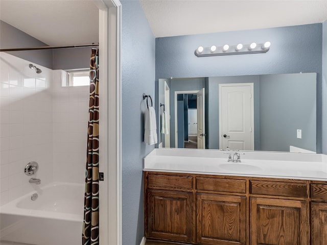5732 Chateau Dr, Sachse, TX 75048 - bathroom with vanity, shower / bathtub combination with curtain, and a textured wall