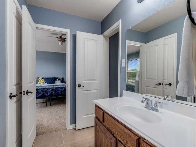 5732 Chateau Dr, Sachse, TX 75048 - ensuite bathroom with vanity, tile patterned flooring, and ceiling fan