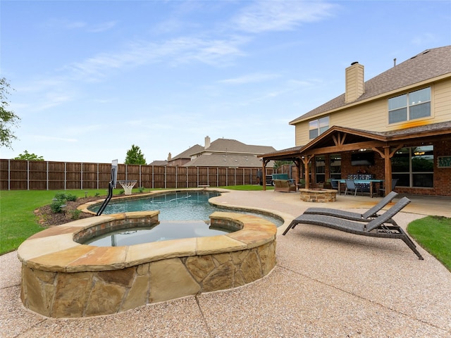 5732 Chateau Dr, Sachse, TX 75048 - view of swimming pool featuring an in-ground hot tub, a fenced backyard, a patio, and an outdoor fire pit