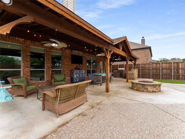 5732 Chateau Dr, Sachse, TX 75048 - view of patio with a ceiling fan, outdoor dining area, an outdoor living space with a fire pit, and exterior kitchen