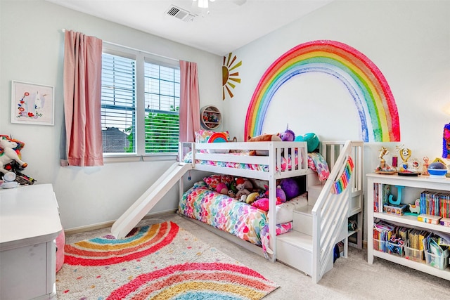 carpeted bedroom with ceiling fan and visible vents