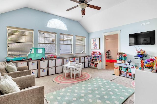 recreation room featuring a ceiling fan, carpet, and lofted ceiling