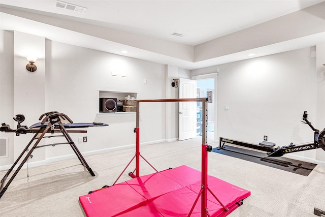 exercise room with carpet flooring, recessed lighting, baseboards, and visible vents