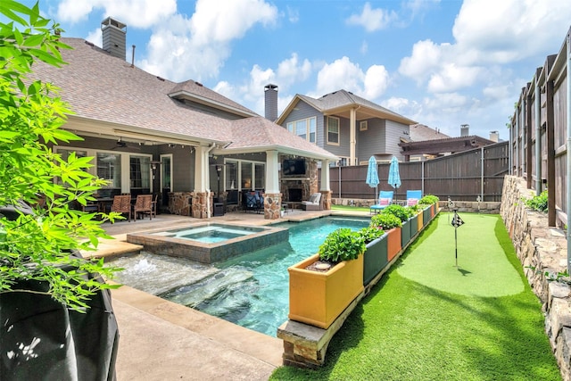 view of swimming pool featuring ceiling fan, outdoor dining area, a fenced backyard, a patio area, and a pool with connected hot tub