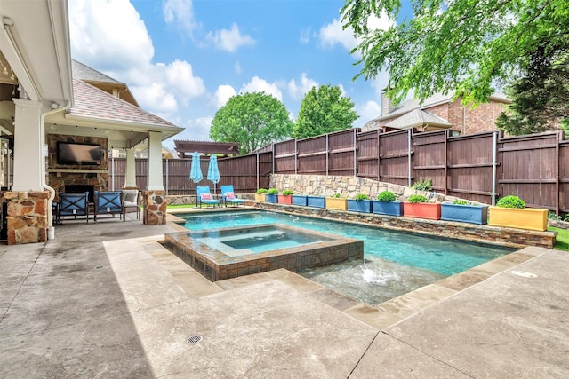 view of pool with fence, a patio, and a pool with connected hot tub