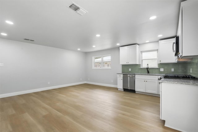 2708 Ash Park Dr, Richland Hills, TX 76118 - kitchen featuring dishwasher, a sink, backsplash, light wood-type flooring, and recessed lighting