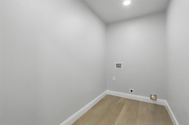 2708 Ash Park Dr, Richland Hills, TX 76118 - laundry area with hookup for an electric dryer, baseboards, hookup for a washing machine, and wood finished floors