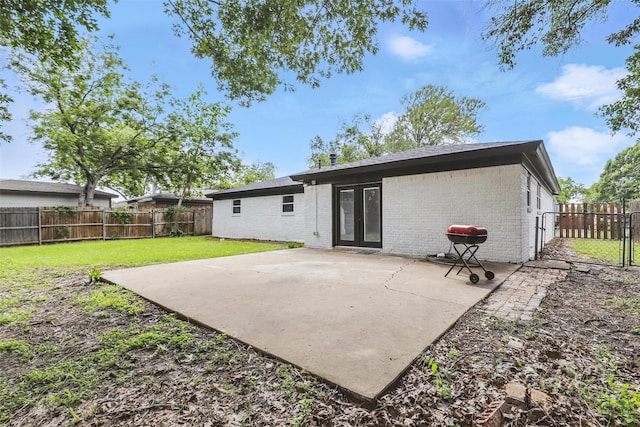 2708 Ash Park Dr, Richland Hills, TX 76118 - back of property featuring brick siding, a patio, and french doors