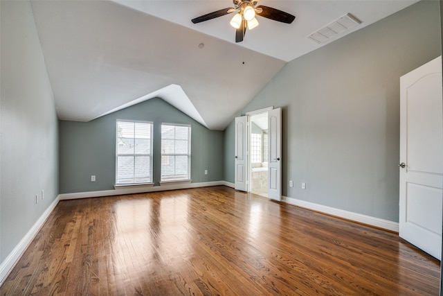 interior space with visible vents, ceiling fan, wood finished floors, and vaulted ceiling