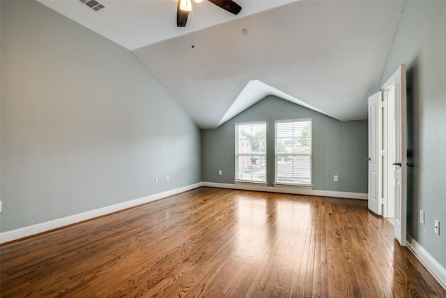 bonus room with a ceiling fan, vaulted ceiling, wood finished floors, and visible vents