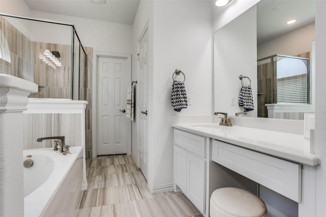 8480 Kincaid Ln, Frisco, TX 75036 - bathroom with vanity, a stall shower, and a garden tub