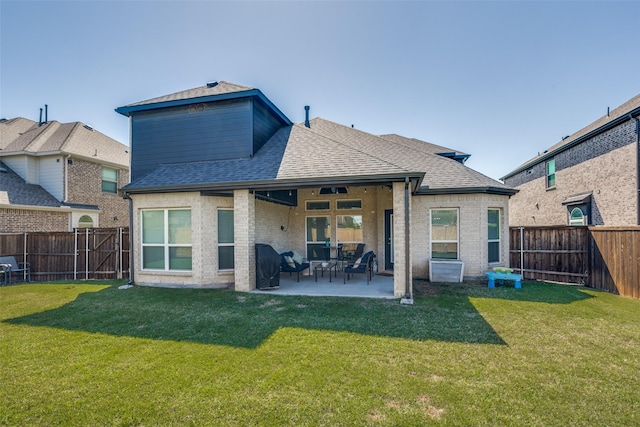 8480 Kincaid Ln, Frisco, TX 75036 - rear view of property with a lawn, a shingled roof, and a fenced backyard