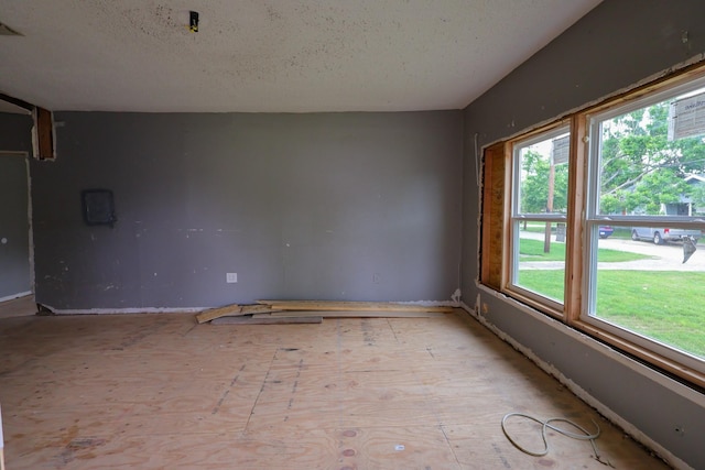 spare room featuring a textured ceiling