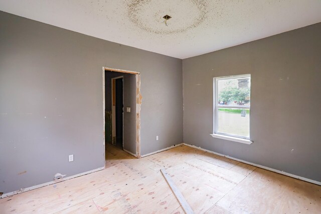 empty room featuring baseboards