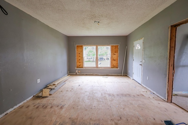 interior space with a textured ceiling