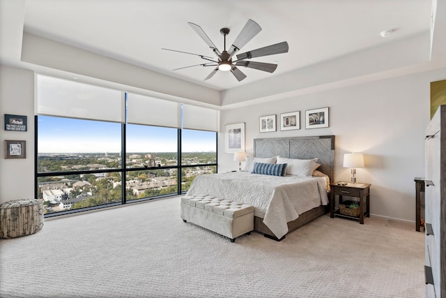 3111 Welborn St Unit 1405, Dallas, TX 75219 - bedroom with baseboards, a ceiling fan, carpet flooring, and expansive windows