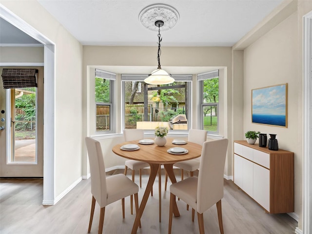 2345 Ravenwood Dr, Grand Prairie, TX 75050 - dining space featuring light wood-style floors and plenty of natural light