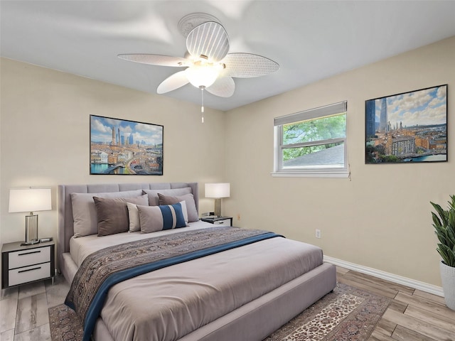 2345 Ravenwood Dr, Grand Prairie, TX 75050 - bedroom with baseboards, ceiling fan, and light wood-style floors