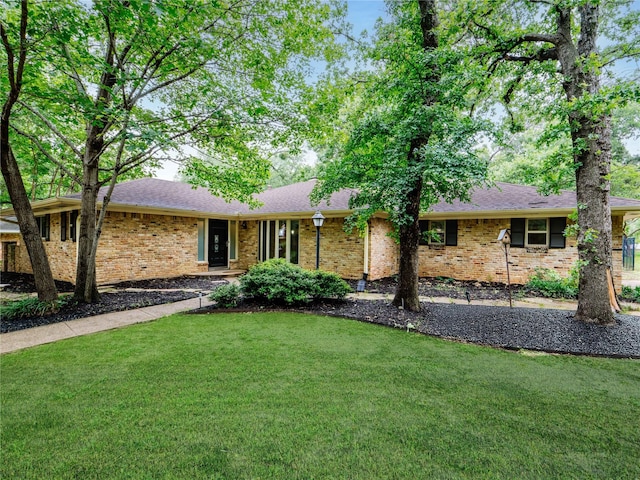 2345 Ravenwood Dr, Grand Prairie, TX 75050 - single story home featuring brick siding, roof with shingles, and a front yard