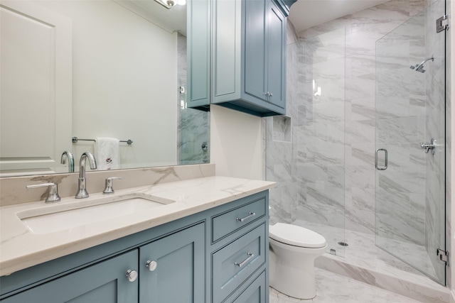 full bath featuring a marble finish shower, vanity, toilet, and marble finish floor
