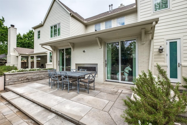 view of patio featuring outdoor dining area
