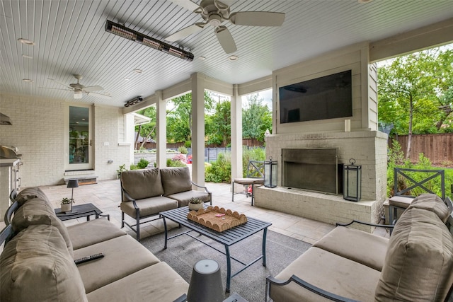 exterior space with a ceiling fan, an outdoor living space with a fireplace, and fence