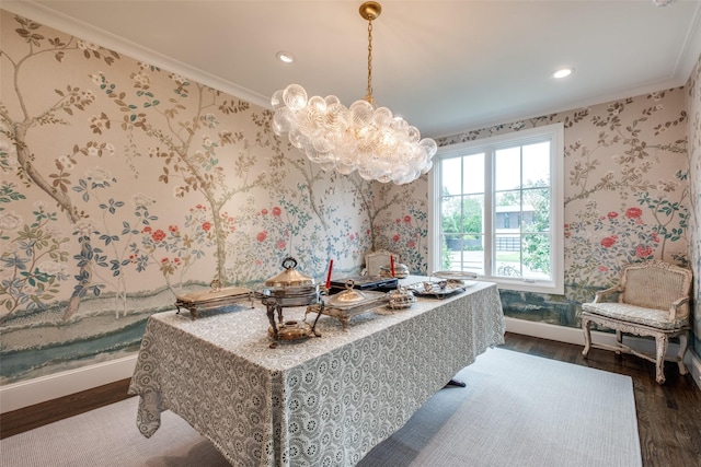 dining room with crown molding, a chandelier, baseboards, and dark wood finished floors