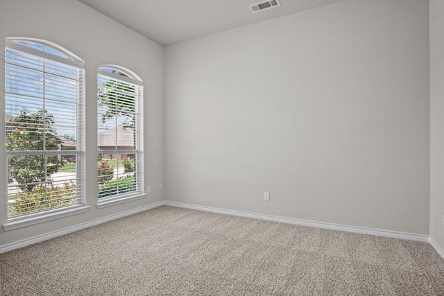 2217 Caroline Dr, Weatherford, TX 76087 - empty room featuring visible vents, carpet, and baseboards
